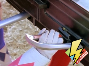 Pink Ranger loads her control rod in the Power Cannon